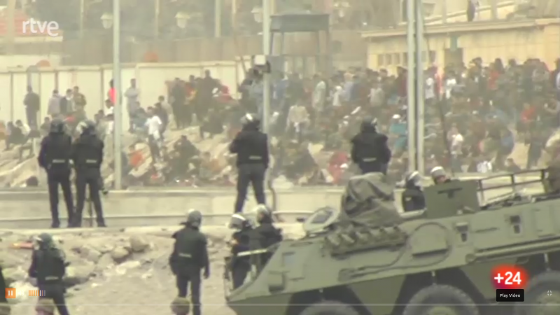The Guardia Civil with tanks and riot gear is stationed next to the fence forming the Tarajal border in Ceuta