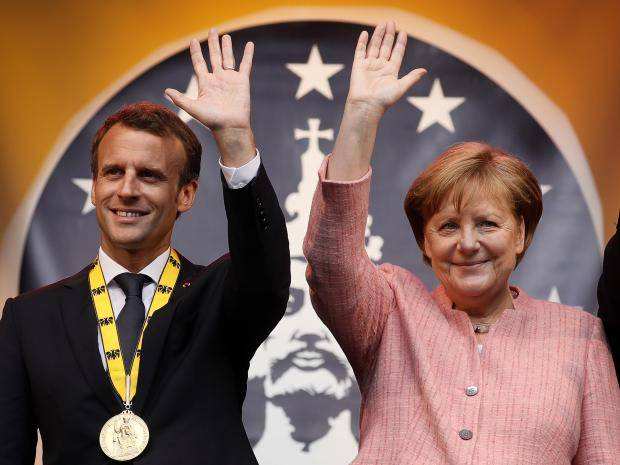 Angela Merkel presents the Charlemagne Prize to Emmanuel Macron, surrounded by "Europeanist" imperial symbolism in May 2018.