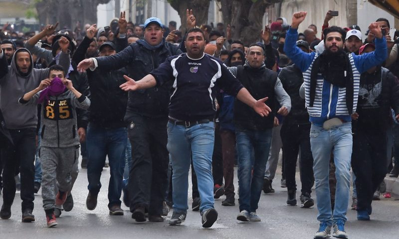 Worker protesters in Tebourba, Tunisia, clash with the police and the army in 2018.