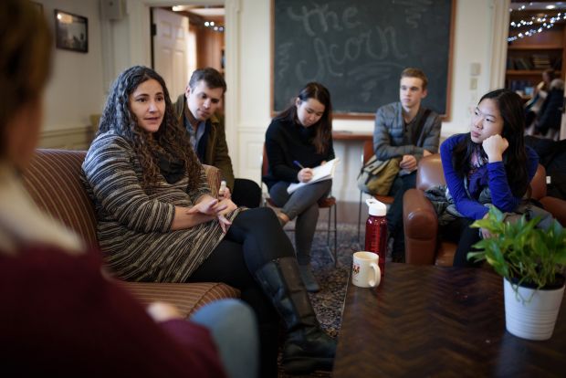 Laurie Santos (left) creator of Science of Well-being course, talks to students.