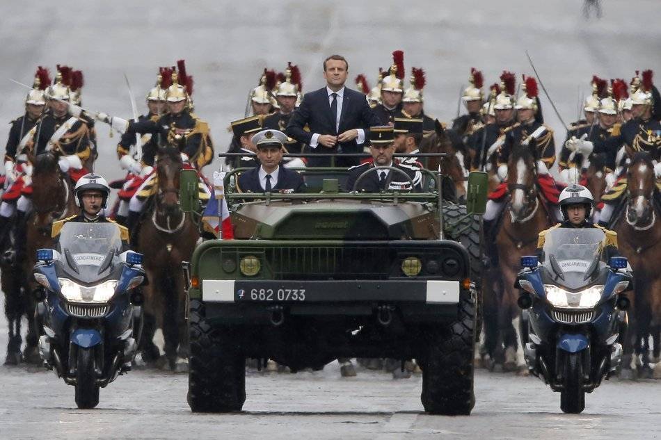 Macron parades on the Champs Elysees.